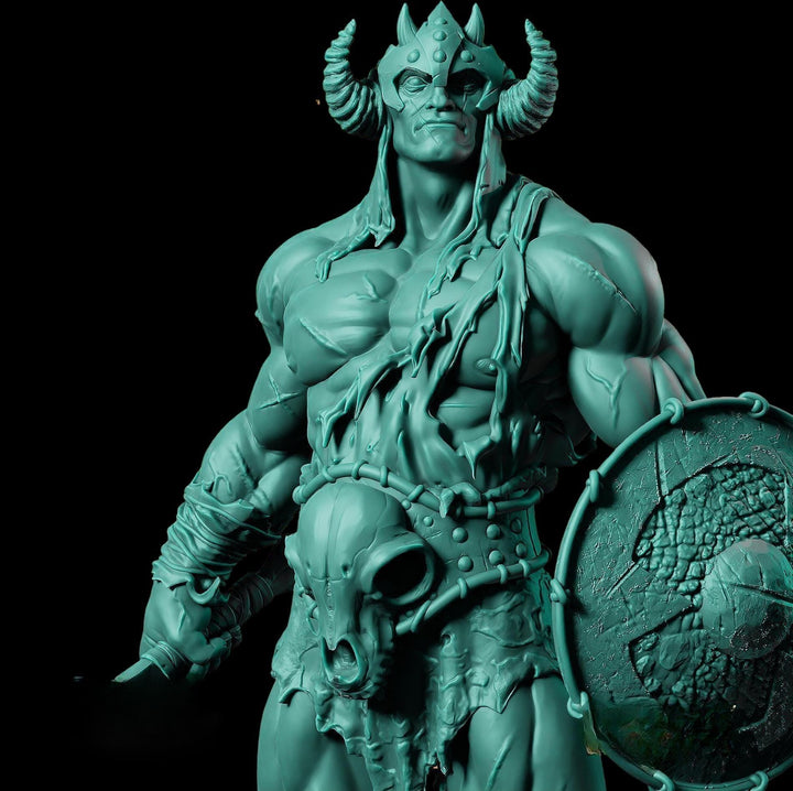 A close-up of a green, muscular statue of a warrior figure with horns, holding a shield and sword.